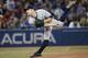 TORONTO, CANADA - SEPTEMBER 17: David Robertson #30 of the New York Yankees delivers a pitch in the eighth inning during MLB game action against the Toronto Blue Jays on September 17, 2013 at Rogers Centre in Toronto, Ontario, Canada. (Photo by Tom Szcz