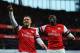 LONDON, ENGLAND - FEBRUARY 16: Lukas Podolski (L) of Arsenal celebrates with team mate Yaya Sanogo after scoring during the FA Cup Fifth Round match between Arsenal and Liverpool at the Emirates Stadium on February 16, 2014 in London, England. (Photo by