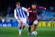 SAN SEBASTIAN, SPAIN - FEBRUARY 12: Lionel Messi of FC Barcelona runs with the ball chased by Antoine Griezmann of Real Sociedad during the Copa del Rey Semi Final second leg between Real Sociedad and FC Barcelona at Anoeta Stadium on February 12, 2014 i
