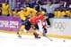 SOCHI, RUSSIA - FEBRUARY 23: Jonathan Toews #16 of Canada falls to the ice while competing with Erik Karlsson #65 of Sweden for the puck during the Men's Ice Hockey Gold Medal match on Day 16 of the 2014 Sochi Winter Olympics at Bolshoy Ice Dome on Febru