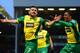 NORWICH, ENGLAND - FEBRUARY 23: Robert Snodgrass of Norwich City (L) celebrates scoring the opening goal with Leroy Fer of Norwich City during the Barclays Premier League match between Norwich City and Tottenham Hotspur at Carrow Road on February 23, 201