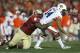 Jan 6, 2014; Pasadena, CA, USA; Auburn Tigers quarterback Nick Marshall (14) is tackled by Florida State Seminoles defensive tackle Timmy Jernigan (8) during the second half of the 2014 BCS National Championship game at the Rose Bowl. Mandatory Credit: Ma