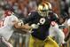 Jan 7, 2013; Miami, FL, USA; Notre Dame Fighting Irish defensive lineman Louis Nix III (9) fights off a block by Alabama Crimson Tide offensive linesman Anthony Steen (61) during the first half of the 2013 BCS Championship game at Sun Life Stadium. Manda
