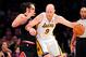 February 9, 2014; Los Angeles, CA, USA; Los Angeles Lakers center Chris Kaman (9) moves the ball against the defense of Chicago Bulls center Joakim Noah (13) during the first half at Staples Center. Mandatory Credit: Gary A. Vasquez-USA TODAY Sports