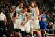 BOSTON, MA - DECEMBER 13: Jared Sullinger #7, Phil Pressey #26 and Kelly Olynyk #41 of the Boston Celtics walk back to the bench after a play against the New York Knicks on December 13, 2013 at the TD Garden in Boston, Massachusetts. NOTE TO USER: User e