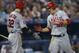 TORONTO, CANADA - SEPTEMBER 10: Mike Trout #27 of the Los Angeles Angels of Anaheim is congratulated by Josh Hamilton #32 after scoring a run in the sixth inning during MLB game action against the Toronto Blue Jays on September 10, 2013 at Rogers Centre i