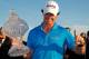 PALM BEACH GARDENS, FL - MARCH 04: Rory McIlroy of Northern Ireland poses with the trophy after winning the Honda Classic at PGA National on March 4, 2012 in Palm Beach Gardens, Florida. (Photo by Mike Ehrmann/Getty Images)
