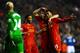 LIVERPOOL, ENGLAND - JANUARY 28: Daniel Sturridge (R) of Liverpool is congratulated by teammates Luis Suarez (C) and Raheem Sterling (L) after scoring his team's third goal as dejected Everton goalkeeper Tim Howard looks on during the Barclays Premier Le