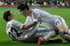 MADRID, SPAIN - FEBRUARY 05: Angel Di Maria (L) of Real Madrid CF celebrates scoring their third goal with teammate Alvaro B. Morata during the Copa del Rey semifinal first leg match between Real Madrid CF and Club Atletico Madrid at Estadio Santiago Ber