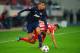 PIRAEUS, GREECE - FEBRUARY 25: Chris Smalling (L) of Manchester United holds off the challenge of Hernan Perez (R) of Olympiacos during the UEFA Champions League Round of 16 first leg match between Olympiacos FC and Manchester United at Karaiskakis Stadi