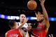 Jan 26, 2014; Oakland, CA, USA; Golden State Warriors guard Stephen Curry (30) is fouled by Portland Trail Blazers guard Damian Lillard (0) while attempting a shot in the fourth quarter at Oracle Arena. The Warriors defeated the Trail Blazers 103-88. Mand