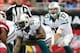 Sept. 30, 2012; Glendale, AZ, USA; Miami Dolphins quarterback Ryan Tannehill (17) and Miami Dolphins center Mike Pouncey (51) against the Arizona Cardinals at University of Phoenix Stadium. Mandatory Credit: Jennifer Stewart-USA TODAY Sports