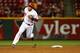 CINCINNATI, OH - SEPTEMBER 23: Devin Mesoraco #39 of the Cincinnati Reds rounds second base before stopping at third during the 10th inning against the New York Mets at Great American Ball Park on September 23, 2013 in Cincinnati, Ohio. Mesoraco would sc