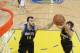 OAKLAND, CA - APRIL 9: Ricky Rubio #9 and Nikola Pekovic #14 of the Minnesota Timberwolves rebound against the Golden State Warriorson April 9, 2013 at Oracle Arena in Oakland, California. NOTE TO USER: User expressly acknowledges and agrees that, by down