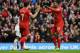LIVERPOOL, ENGLAND - FEBRUARY 23: Daniel Sturridge of Liverpool celebrates scoring his team's third goal with Luis Suarez during the Barclays Premier League match between Liverpool and Swansea City at Anfield on February 23, 2014 in Liverpool, England.