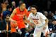 CHARLOTTESVILLE, VA - MARCH 01: Tyler Ennis #11 of the Syracuse Orange controls the ball against the defense of London Perrantes #23 of the Virginia Cavaliers during the first half at John Paul Jones Arena on March 1, 2014 in Charlottesville, Virginia.