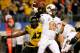 ARLINGTON, TX - JANUARY 03: Quarterback Clint Chelf #10 of the Oklahoma State Cowboys throws the ball as Kony Ealy #47 of the Missouri Tigers rushes in during the second half during the AT&T Cotton Bowl on January 3, 2014 in Arlington, Texas. (Photo by