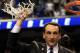 GREENSBORO, NC - MARCH 13: Head coach Mike Krzyzewski of the Duke Blue Devils cuts down the net after defeating the North Carolina Tar Heels 75-58 in the championship game of the 2011 ACC men's basketball tournament at the Greensboro Coliseum on March 13