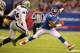 EAST RUTHERFORD, NJ - NOVEMBER 10: Hakeem Nicks #88 of the New York Giants runs after a catch against Kevin Burnett #94 of the Oakland Raiders during their game at MetLife Stadium on November 10, 2013 in East Rutherford, New Jersey. (Photo by Al Bell