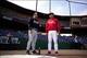 Mar 5, 2014; Clearwater, FL, USA; Atlanta Braves manager Fredi Gonzalez (33) and Philadelphia Phillies manager Ryne Sandberg (23) talk before a spring training exhibition game at Brighthouse Networks Field. Mandatory Credit: David Manning-USA TODAY Sports