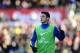 STOKE ON TRENT, ENGLAND - MARCH 01: Mesut Ozil of Arsenal warms up as a substitute during the Barclays Premier League match between Stoke City and Arsenal at Britannia Stadium on March 1, 2014 in Stoke on Trent, England. (Photo by Laurence Griffiths/Get