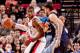 PORTLAND, OR - MARCH 12: LaMarcus Aldridge #12 of the Portland Trail Blazers posts-up against Marc Gasol #33 of the Memphis Grizzlies on March 12, 2013 at the Rose Garden Arena in Portland, Oregon. NOTE TO USER: User expressly acknowledges and agrees that