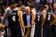 Dec 18, 2013; Phoenix, AZ, USA; San Antonio Spurs head coach Gregg Popovich (center) talks to his players during a time out in the second half against the Phoenix Suns at US Airways Center. The Spurs defeated the Suns 108-101. Mandatory Credit: Mark J. Re