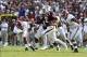 Sep 14, 2013; College Station, TX, USA; Texas A&M Aggies quarterback Johnny Manziel (2) scrambles in the fourth quarter against Alabama Crimson Tide defensive end Jonathan Allen (93) and Jeoffrey Pagan (8) at Kyle Field. Alabama Crimson Tide beat the Tex