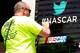 LONG POND, PA - JUNE 08: A track worker applies a NASCAR Twitter decal in victory lane during practice for the NASCAR Sprint Cup Series Pocono 400 at Pocono Raceway on June 8, 2012 in Long Pond, Pennsylvania. (Photo by Geoff Burke/Getty Images for NASCAR