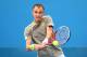SYDNEY, AUSTRALIA - JANUARY 08: Lukas Rosol of the Czech Republic plays a backhand in his match against Dmitry Tursunov of Russia during day four of the 2014 Sydney International at Sydney Olympic Park Tennis Centre on January 8, 2014 in Sydney, Australi