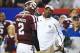 Dec 31, 2013; Atlanta, GA, USA; Texas A&M Aggies quarterback Johnny Manziel (2) speaks with head coach Kevin Sumlin during the second quarter against the Duke Blue Devils in the 2013 Chick-fil-A Bowl at the Georgia Dome. Mandatory Credit: Daniel Shirey-U