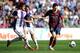 VALLADOLID, SPAIN - MARCH 08: Lionel Messi (R) of FC Barcelona is tackled by Stefan Mitrovic of Valladolid CF during the La Liga match between Real Valladolid CF and FC Barcelona at estadio Nuevo Jose Zorillo on March 8, 2014 in Valladolid, Spain. (Phot