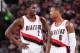 PORTLAND, OR - NOVEMBER 25: Damian Lillard #0 and Wesley Matthews #2 of the Portland Trail Blazers stand on the court against the New York Knicks on November 25, 2013 at the Moda Center Arena in Portland, Oregon. NOTE TO USER: User expressly acknowledges