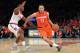 NEW YORK, NY - DECEMBER 15: Tyler Ennis #11 of the Syracuse Orange drives the ball down the court against Phil Greene IV #1 of the St. John's Red Storm during the game at Madison Square Garden on December 15, 2013 in New York City. (Photo by Nate Shron/G