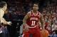 Feb 25, 2014; Madison, WI, USA; Indiana Hoosiers guard Yogi Ferrell (11) looks to pass as Wisconsin Badgers guard Josh Gasser defends at the Kohl Center. Wisconsin defeated Indiana 69-58. Mandatory Credit: Mary Langenfeld-USA TODAY Sports