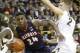 IOWA CITY, IA - MARCH 8: Guard Rayvonte Rice #24 of the Illinois Fighting Illini goes to the basket during the first half in front of guard Josh Oglesby #2 of the Iowa Hawkeyes on March 8, 2014 at Carver-Hawkeye Arena, in Iowa City, Iowa. (Photo by Matth