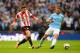 LONDON, ENGLAND - MARCH 02: Fabio Borini of Sunderland is closed down by Martin Demichelis of Manchester City during the Capital One Cup Final between Manchester City and Sunderland at Wembley Stadium on March 2, 2014 in London, England. (Photo by Micha