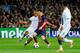 BARCELONA, SPAIN - MARCH 12: Lionel Messi of Barcelona is tackled by Vincent Kompany of Manchester City during the UEFA Champions League Round of 16, second leg match between FC Barcelona and Manchester City at Camp Nou on March 12, 2014 in Barcelona, S