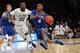Mar 13, 2014; New York, NY, USA; Seton Hall Pirates guard Sterling Gibbs (4) controls the ball against Villanova Wildcats forward JayVaughn Pinkston (22) during the second half of a game in the second round of the Big East college basketball tournament at