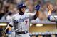 Milwaukee, WI - APRIL 18: James Loney #7 of the Los Angeles Dodgers high fives Mark Ellis after scoring the Dodgers first run against the Milwaukee Brewers during the game at Miller Park on April 18, 2012 in Milwaukee, Wisconsin. (Photo by Mike McGinnis