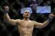 Robbie Lawler celebrates his victory over Rory MacDonald, of Canada, following a UFC 167 mixed martial arts welterweight bout on Saturday, Nov. 16, 2013, in Las Vegas. Lawler won by split decision. (AP Photo/Isaac Brekken)