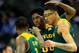 KANSAS CITY, MO - MARCH 14: Royce O'Neale #00 of the Baylor Bears congratulates Isaiah Austin #21 and Kenny Chery #1 as they walk back to the bench during a timeout in the Big 12 Basketball Tournament semifinal game against the Texas Longhorns at Sprint