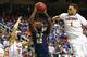 GREENSBORO, NC - MARCH 15: Talib Zanna #42 of the Pittsburgh Panthers drives to the basket against teammates Justin Anderson #1 and Anthony Gill #13 of the Virginia Cavaliers during the semifinals of the 2014 Men's ACC Basketball Tournament at Greensboro