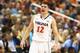 GREENSBORO, NC - MARCH 15: Joe Harris #12 of the Virginia Cavaliers yells to teammates against the Pittsburgh Panthers during the semifinals of the 2014 Men's ACC Basketball Tournament at Greensboro Coliseum on March 15, 2014 in Greensboro, North Carolin