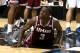 NEW YORK, NY - MARCH 14: Chaz Williams #3 of the Massachusetts Minutemen lies on the court reacting to a call in the second half against the George Washington Colonials during the Quarterfinals of the 2014 Atlantic 10 Men's Basketball Tournament at Barcla