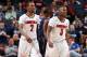 MEMPHIS, TN - MARCH 15: Russ Smith #2 and Chris Jones #3 of the Louisville Cardinals walk towards the bench against the Connecticut Huskies during the Championship of the American Athletic Conference Tournament at FedExForum on March 15, 2014 in Memphis,