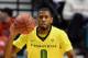 LAS VEGAS, NV - MARCH 12: Mike Moser #0 of the Oregon Ducks grabs a loose ball during a first-round game of the Pac-12 Basketball Tournament against the Oregon State Beavers at the MGM Grand Garden Arena on March 12, 2014 in Las Vegas, Nevada. Oregon won
