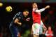 LONDON, ENGLAND - FEBRUARY 12: (L-R) Rio Ferdinand of Manchester United and Olivier Giroud of Arsenal challenge for the ball during the Barclays Premier League match between Arsenal and Manchester United at the Emirates Stadium on February 12, 2014 in Lo