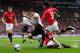 MANCHESTER, ENGLAND - MARCH 16: Luis Suarez of Liverpool goes down in the penalty area following a challenge by Phil Jones of Manchester United during the Barclays Premier League match between Manchester United and Liverpool at Old Trafford on March 16,