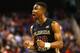 GREENSBORO, NC - MARCH 13: Ian Miller #30 of the Florida State Seminoles reacts after a play against the Maryland Terrapins during the second round of the 2014 Men's ACC Basketball Tournament at Greensboro Coliseum on March 13, 2014 in Greensboro, North